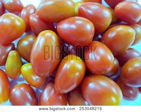 Top View Of Cherry Tomatoes As A Background (solanum Lycopersicum Var. Cerasiforme)