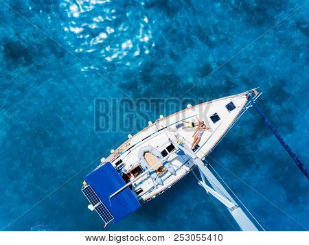 Amasing Aerial View To Yacht In Deep Blue Sea With Relaxing Kids. Drone Photography