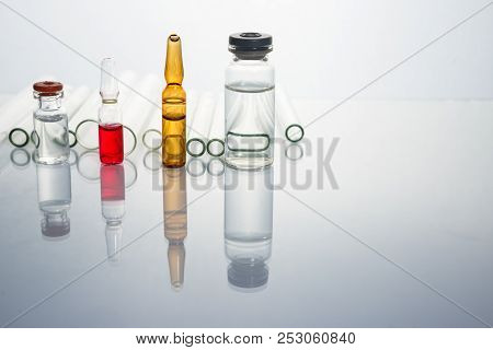 Group Of Vials With Medication On Blue Methacrylate Table. Horizontal Composition.