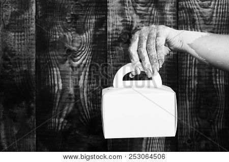 Female Hand Smeared In Golden Paint Or Glister Holding Yellow Paper Valentine Present Box On Brown V