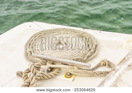 The Rope Rope Is Neatly Folded On The Ship's Deck