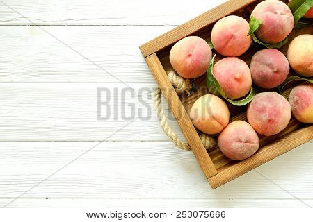 Healthy Eating Concept. Wooden Tray Fully Stacked With Local Produce Farm Grown Organic Ripe Peaches