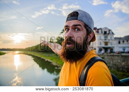 Guy In Front Of Blue Sky At Evening Time Admire Landscape. Enjoy Pleasant Moment. Man In Cap Enjoy S