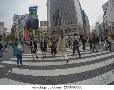 Tokyo, Japan - April 27, 2016: Japanese People Are Crossing The Road