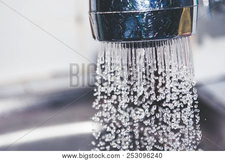 Water From Steel Tap Was Being Thrown Away In Kitchen