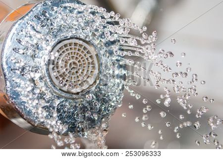 Close Up Water Flowing Out From Sink Shower In Kitchen