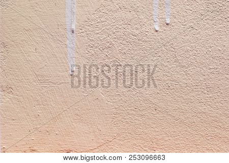 Close Up Photo Of A Pink Concrete Wall With Rough Surface In Detail, There Is Dry Drop Of Painting O