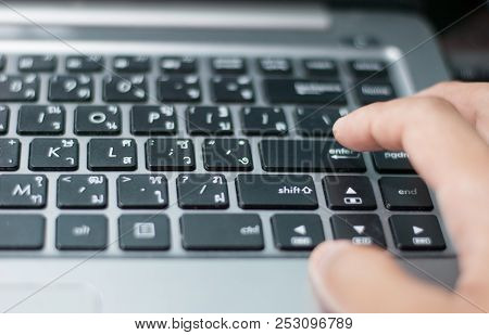 An Index Finger Is About To Press On Enter Button Of A Computer Laptop Keyboard In Order To Make Dec