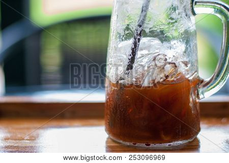 Refreshing Photo Of Tall-shape Glass With Half Amount Of Iced Espresso Coffee Inside Which Was Drank