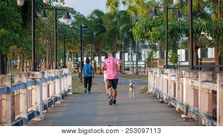 Sattahip, Chonburi, Thailand - February 09, 2018: A Mature Man On Pink Shirt Is Running On The Bridg