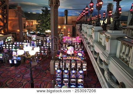 Las Vegas, Usa - April 14, 2014: People Play Slot Games At Paris Las Vegas Casino. The Resort Was Op