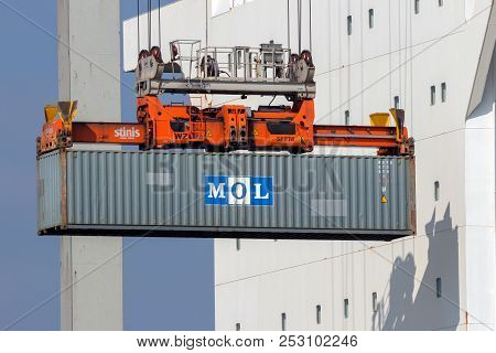 Rotterdam - Mar 16, 2016: Crane Operator Placing A Container In A Cargo Ship The Port Of Rotterdam.