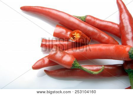 Red Chilly Chutney And Chilies On White Background. A Rural Food Item In India.