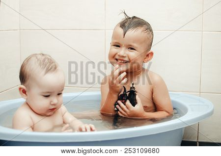 Children, Brother And Sister In The Bathroom