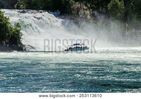 The Sightseeing Boat Swims Close To The Rhine Falls. Landscape.