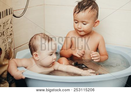 Children, Brother And Sister In The Bathroom