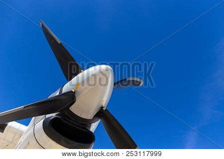Bottom View Of Aircraft Propeller Blade And Turboprop Engines With Blue Sky Background And Copy Spac