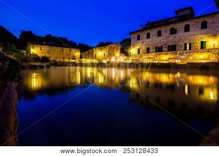 Ancient Thermal Bath In Bagno Vignoni, A Medieval Village In Tuscany, In The Evening, Italy