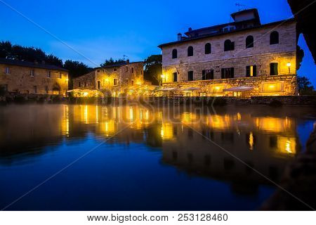 Ancient Thermal Bath In Bagno Vignoni, A Medieval Village In Tuscany, In The Evening, Italy