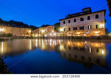 Ancient Thermal Bath In Bagno Vignoni, A Medieval Village In Tuscany, In The Evening, Italy
