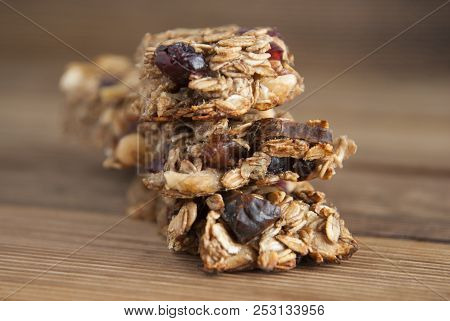 Healthy Snack. Close Up Cereal Granola Bars With Nuts, Dried Fruits, Bannana, Honey And Oat Meal. I