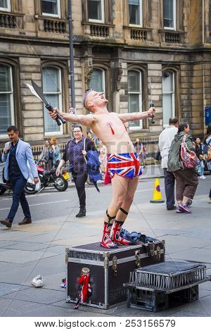 Edinburgh, Scotland  - August 7: Busker Spikey Will Calling To The Crowd At The Edinburgh Fringe Fes