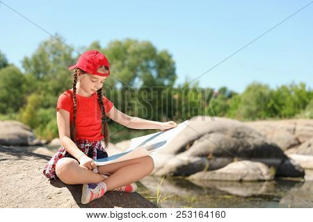 Little Girl With Map Outdoors. Summer Camp