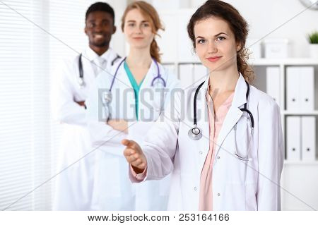 Medical Team Of Confident Doctors Showing Ok Sign With Thumbs Up. Medicine And Health Care, Insuranc