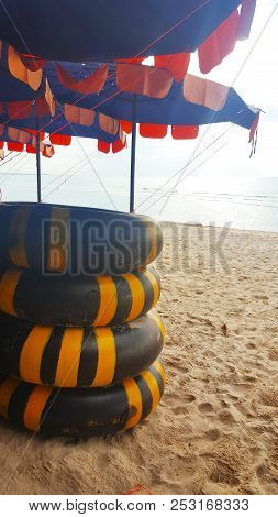 August 3, 2018:  Life Ring On The Sand And Umbrella On Beach, Beautiful Sea View Background At Cha-a