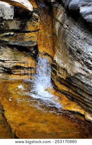 Rocky Wall And Ledges Guide Cascading Water In The Ozark Mountains Of Arkansas.