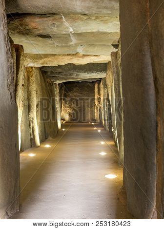 Trigueros, Spain - July 2nd, 2018: Dolmen De Soto Interior. Corridor From Entrance View, Trigueros, 