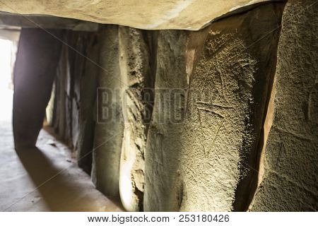 Trigueros, Spain - July 2nd, 2018: Dolmen De Soto Engravings, Daggers. The Biggest One Megalithic Mo