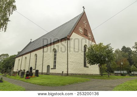Church At Backen, Umea, Sweden With A Cloudy Sky.