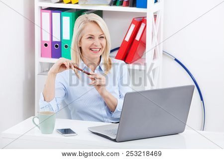 Business Woman Working On A Aptop. Chatting With The Client Online Via Chat. Stormy Emotions Express