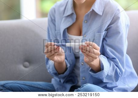 Young Woman With Pregnancy Test At Home. Gynecology