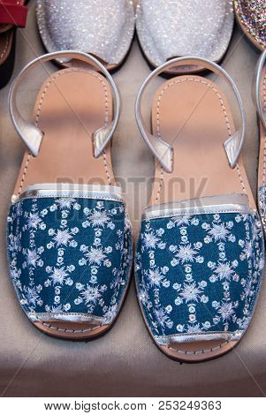 Pair Of Spanish Shoes Selling At A Market Along A Street