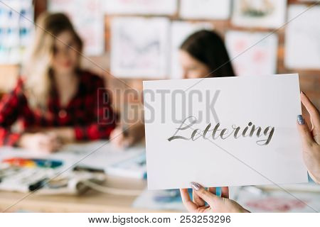 Lettering Art And Calligraphy Craft. Italic Cursive Handwriting Courses. Woman Hands Holding Paper W