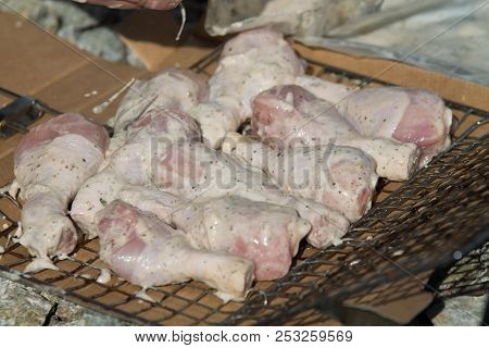 Raw Chicken Legs Prepared On A Wooden Board For Cooking