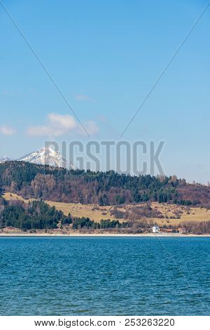 Slovakia: Small Village Near The Tatra Mountain. Liptovska Mara Lake In Foreground. Winter And Snow