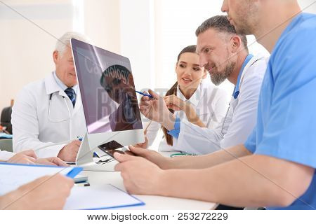 Group Of Doctors Attending Meeting In Clinic. Cardiology Conference