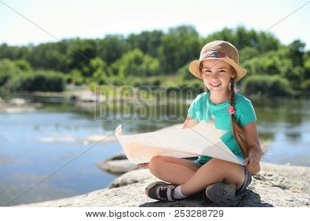 Little Girl With Map Outdoors. Summer Camp