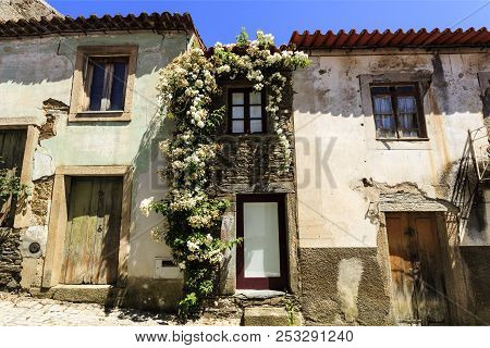 View Of A Narrow Traditional Schist And Granite House Right In The Middle Of The Medieval Village Of