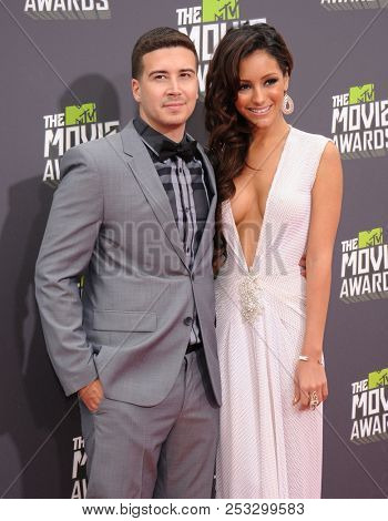 LOS ANGELES - APR 14:  Vinny Guadagnino & Melanie Iglesias arrives to the MTV Movie Awards 2013  on April 14, 2013 in Hollywood, CA                