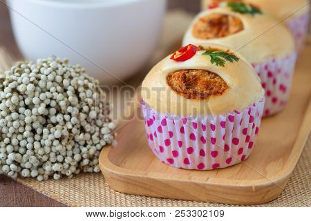 Homemade Soft And Sticky Bun Filled With Dried Shredded Pork On Wood Plate. Soft White Bread With Po