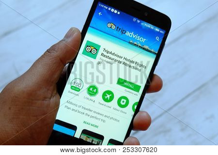 Bandar Seri Begawan,brunei - July 25th,2018 : A Male Hand Holding Smartphone With Tripadvisor App On