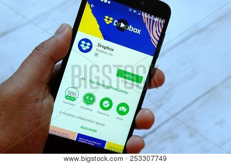 Bandar Seri Begawan,brunei - July 25th,2018 : A Male Hand Holding Smartphone With Dropbox Apps On An