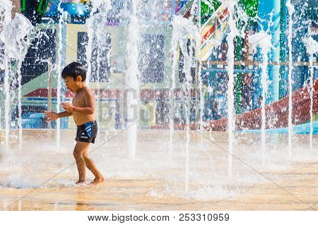 Pataya, Thailand - 01 July 2016 - A Boy Enjoy Playing With Floor Water Fountain At Cartoon Network W