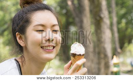 Cute Girl Eat Ice Cream In Close Up Face Feeling Delicious