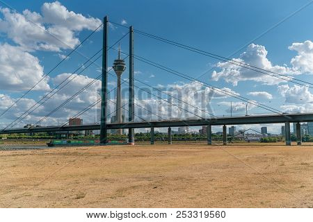 Duesseldorf, Germany - August 10, 2018: Drought In Germany, Low Water Of The Rhine River With The Ci