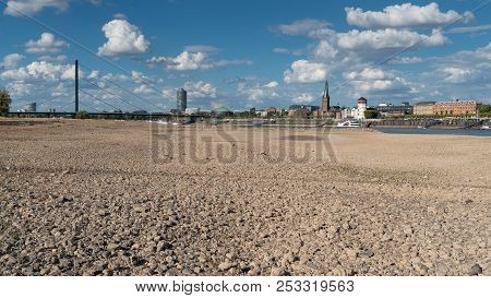 Duesseldorf, Germany - August 10, 2018: Drought In Germany, Low Water Of The Rhine River With The Ci